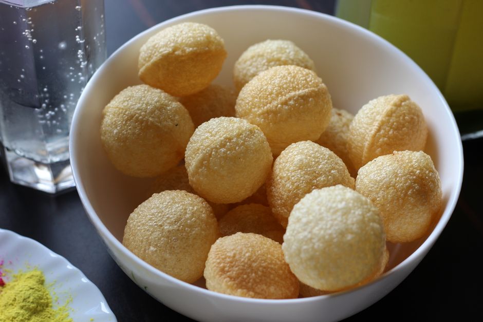 Close-up view of traditional Indian panipuri shells, a popular street food snack.