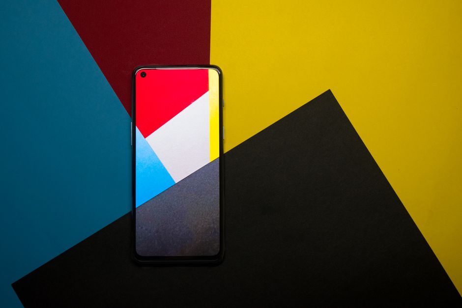 Modern smartphone displayed on vibrant geometric background, perfect for tech and design purposes.