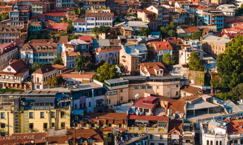 Vibrant aerial view showcasing the diverse architecture of Tbilisi, Georgia.