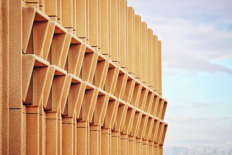 Contemporary building facade featuring sharp geometric patterns in a modern architectural design.