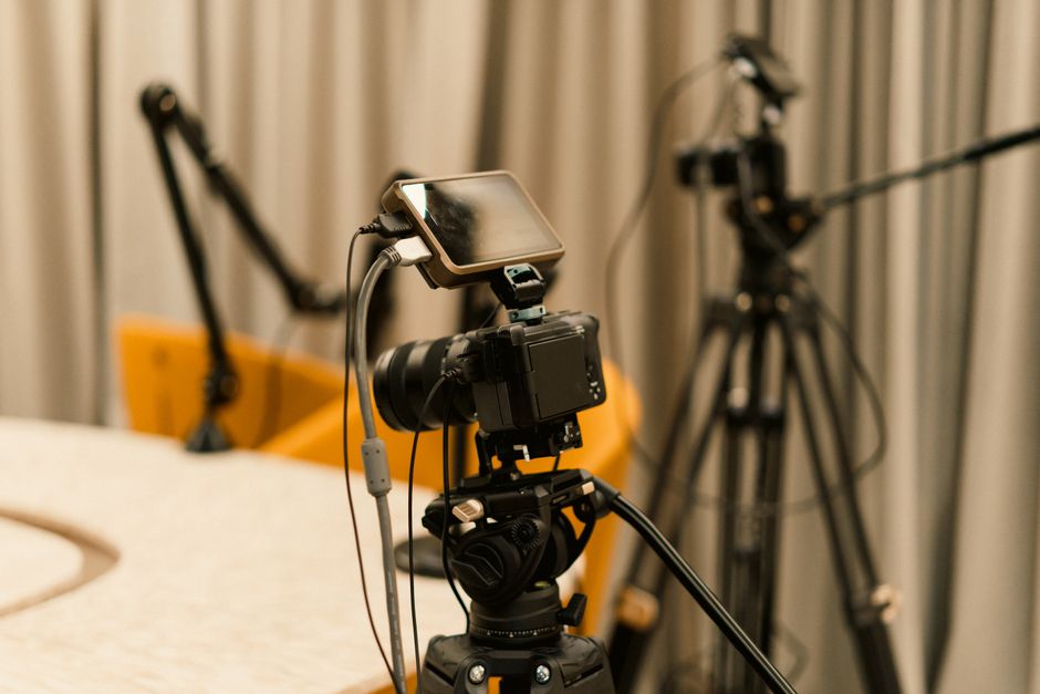 A professional studio with cameras, microphones, and other equipment ready for recording or live streaming.
