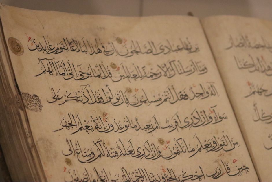 Aurengzeb- sixth mugal emperor A detailed view of ancient book pages showcasing intricate Arabic calligraphy.