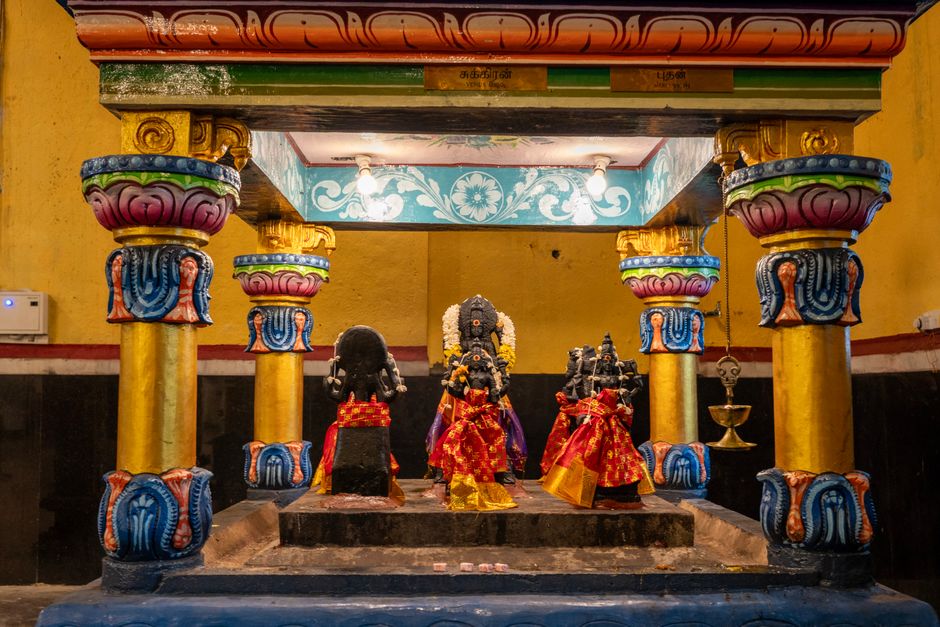 Vibrant Hindu shrine with detailed carvings inside a Sri Lankan temple, capturing cultural richness.