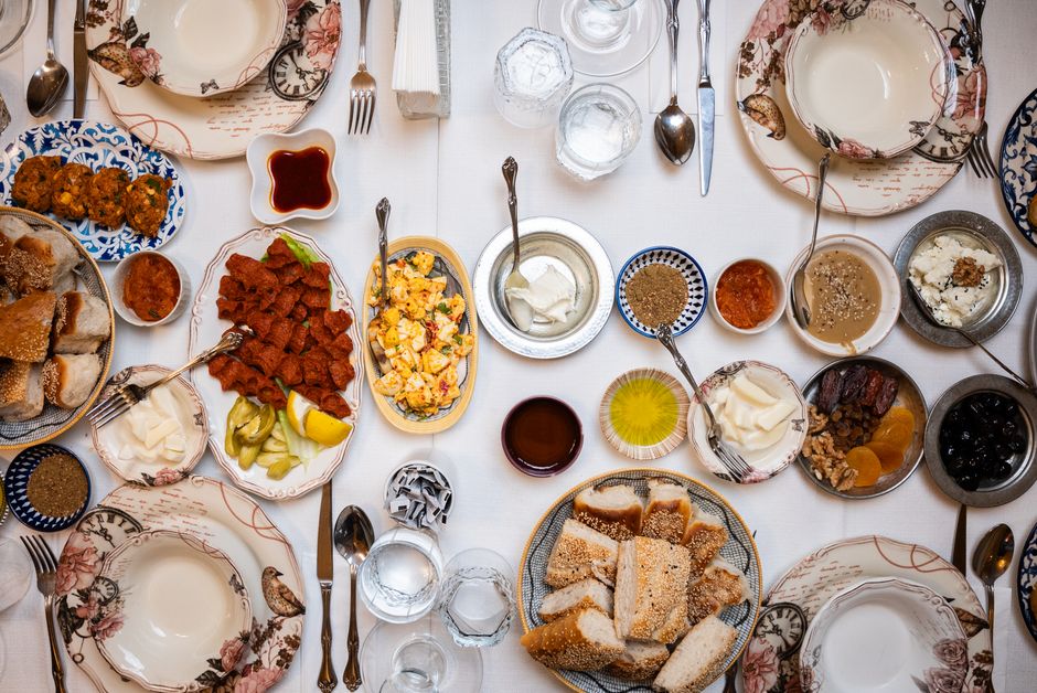 Overhead view of a Turkish table with diverse dishes, showcasing a traditional meal setting.