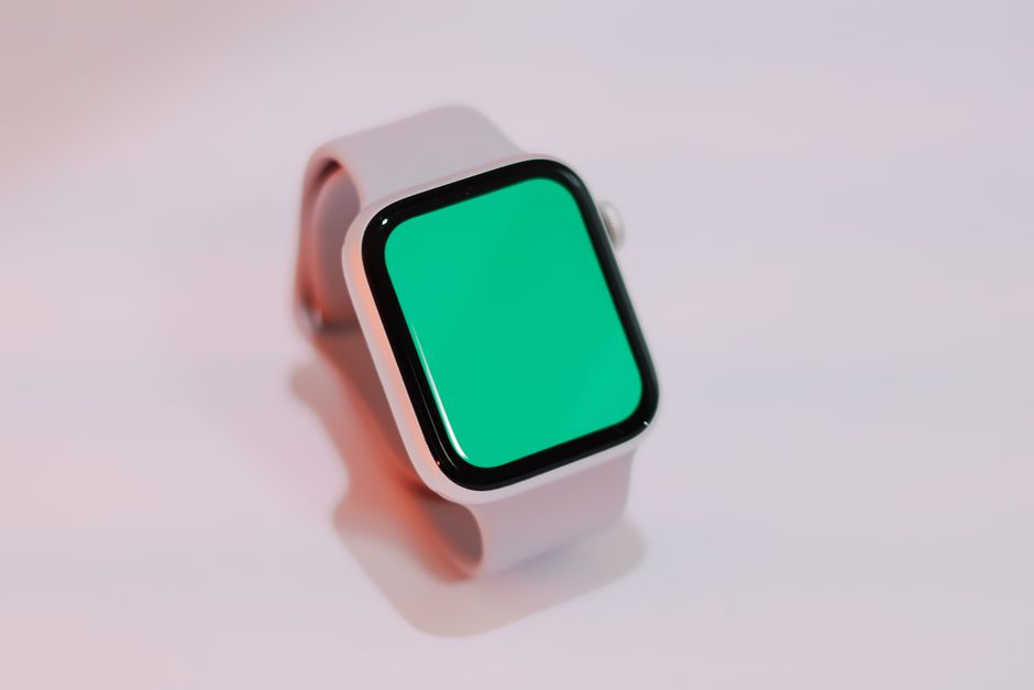 Neuralink technology Smartwatch with a blank green screen displayed on a light background, suitable for mockups.