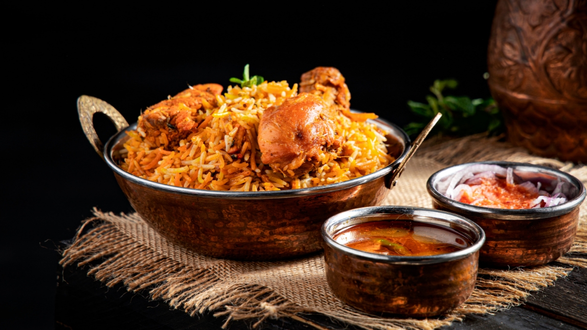 Delicious homemade chicken biryani with basmati rice, tender chicken, fried onions, and fresh herbs.